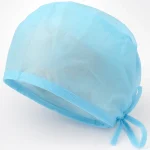 Close-up of disposable doctor tie cap material and adjustable tie-back construction