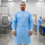 Gown with PE film product image for disposable protective wear supply in the UAE and GCC.