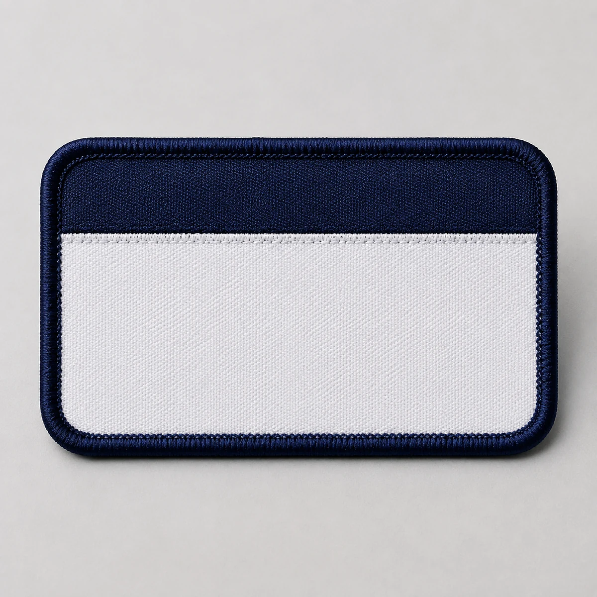 woven-name-badge-uniform-supplier-uae-01 Woven name badge product image for corporate uniform supply in the UAE and GCC.